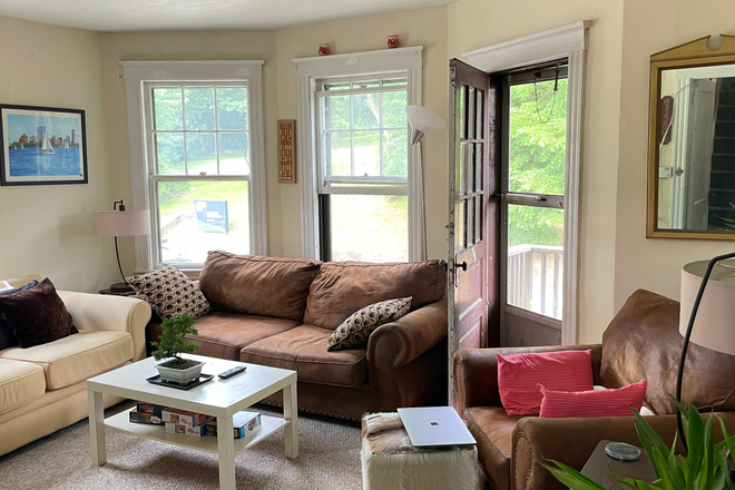Living room - Driveway parking. Great location. Better rent! :) Duplex