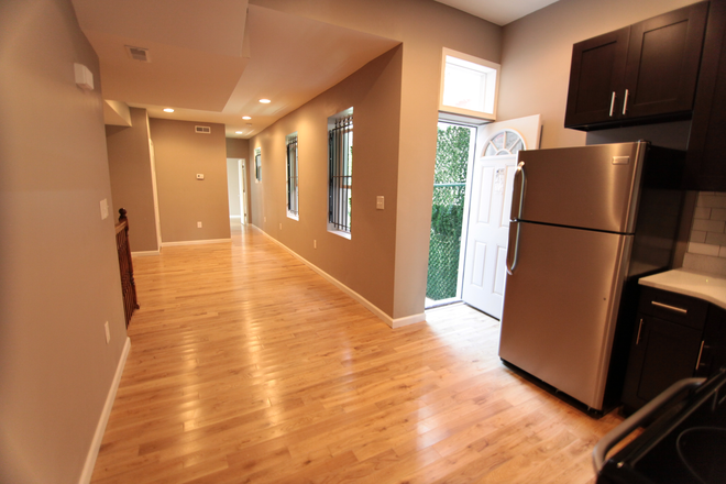 Living Room - OCP - Newly Renovated With Private Patio - 4 Bed 3 Bath Apartments