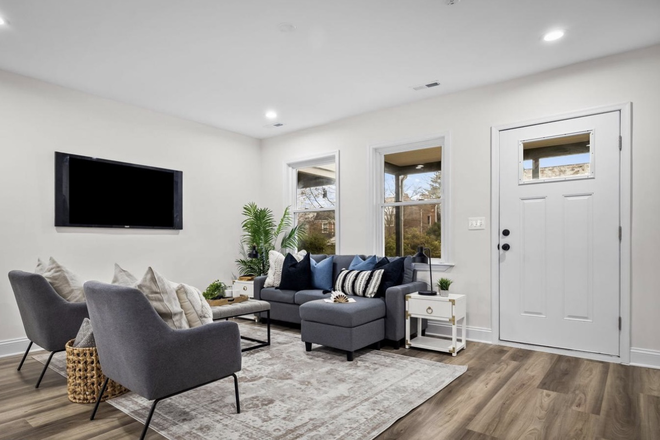 Living room and entry - Renovated 4 Bedroom 2 Bathroom Townhouse 2 Blocks from Towson University!