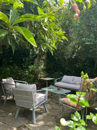 One of two sitting areas in the back yard, roses and shaded for summer, afternoon sun sun - Charming 3bd house, bay views, beautiful yard, wood floors, short distance to UC. Available Jan-June