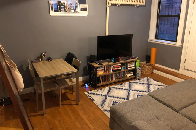 Living Room - Fenway 1-bed with hardwoods, updated kitchen, private patio, and roof deck. Apartments
