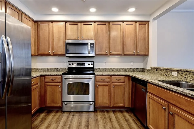 Kitchen - Furnished Private BR + Full Bath | New Town Condo | $1,100/mo