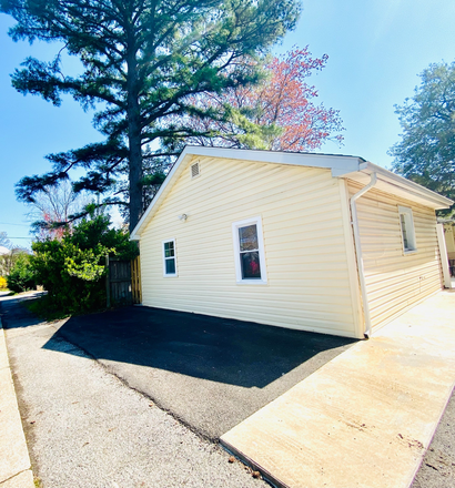 rear exterior of unit and parking space - Detached Unit (Complete Mini Home) with One Bedroom and One Bath