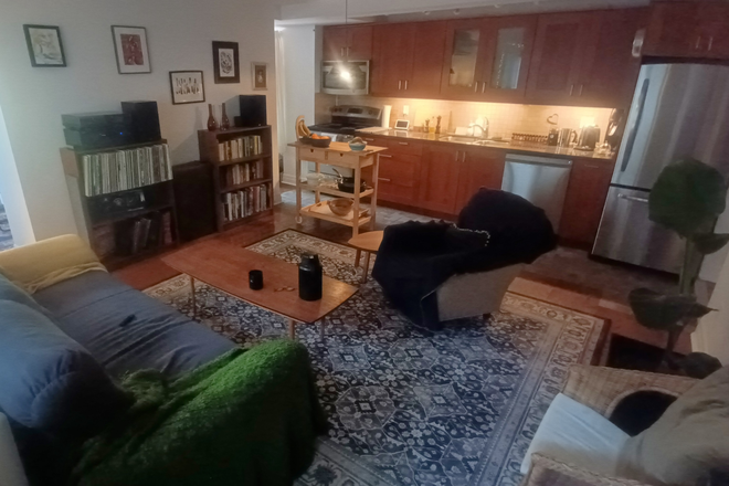 View of the shared living room/kitchen from the front door - 2-Bedroom 1-Year Sublet: High Park Toronto Triplex