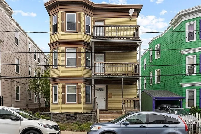 Front view with front patios - Top Apt in Multi-family house