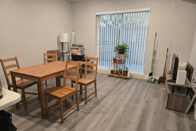 Living/Dining room + balcony - Modern 3bed, 3bath apartment in University City!