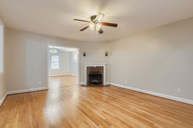 Living room - "Move-In Ready: Updated 4BR Rowhome, Steps from Hopkins & Shopping"