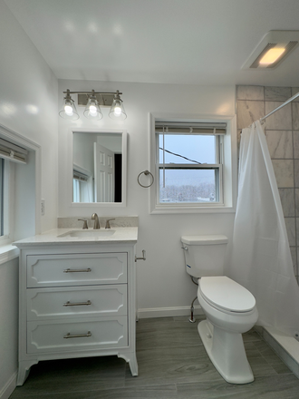 Marble bathroom tiles. 2-year old vanity and bathroom set up. Luxury vinyl flooring. - Completely Renovated Central Air Property Right Next to Hopkins Townhome