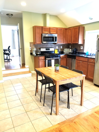 Open Layout Kitchen living room- high cathedral ceilings - 3BR/2BA Waltham Apartment | $3,300 | NO FEE | Parking | Laundry | Central A/C